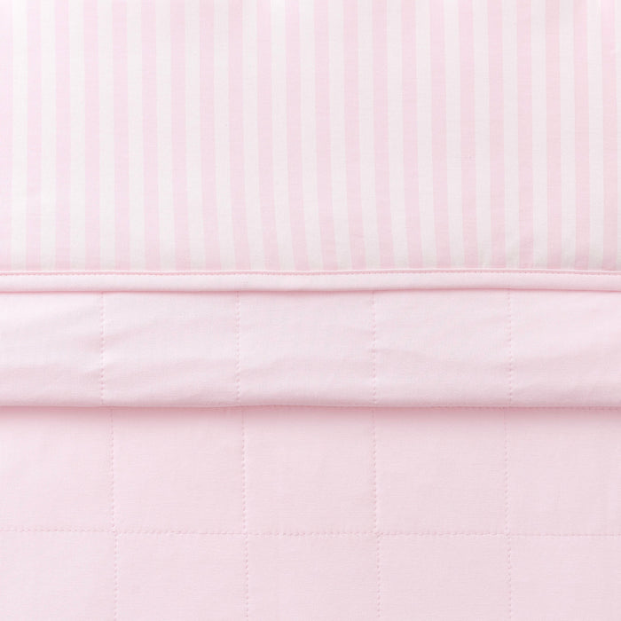 Toddler Blanket in Small Sakura Stripe 1.0 folded showing the quilted detail on the back of the blanket and the print detail on the front