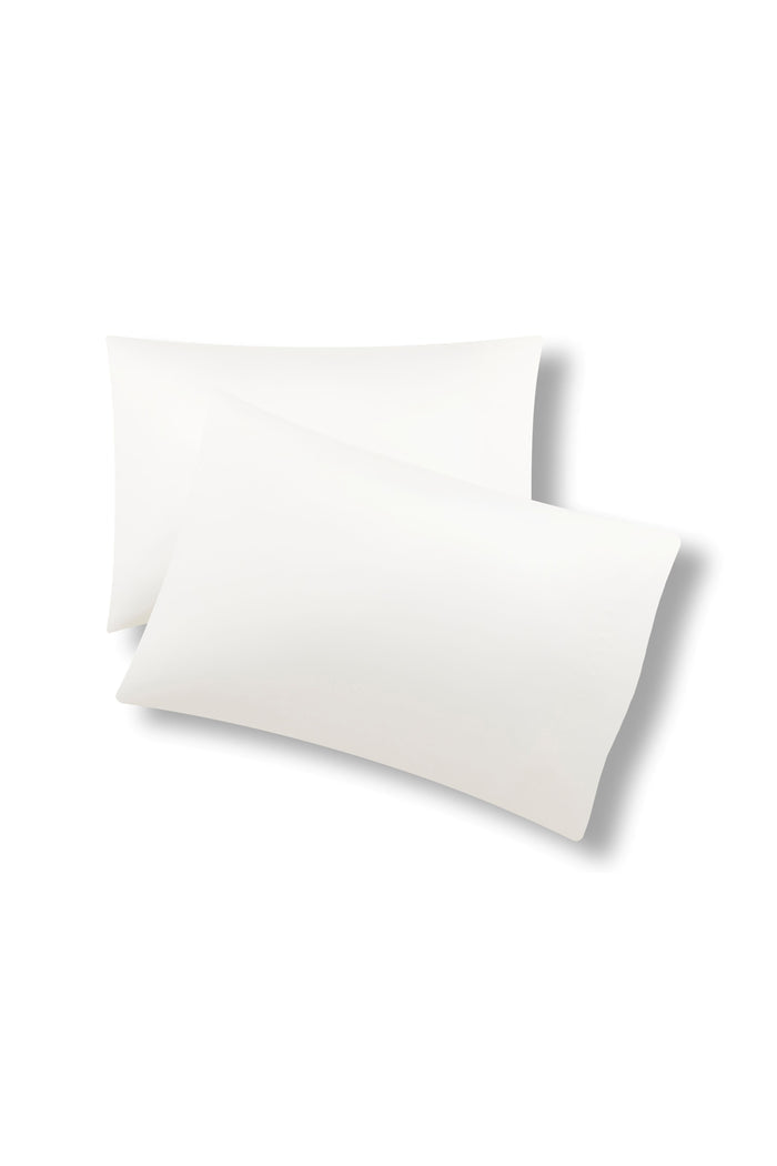 Two pillow cases on one top of the other with the Bamboo Sateen Pillowcases in Shell on them