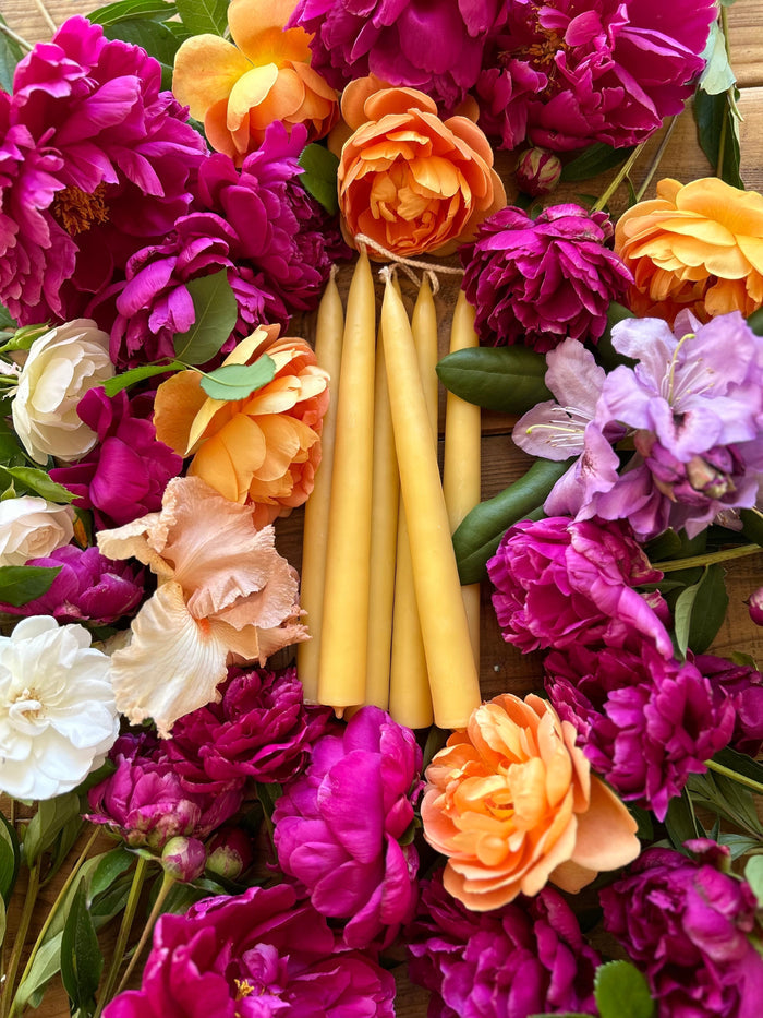 Busy Bees Hand Dipped 9 Inch Taper Candles arranged in a colorful floral centerpiece.