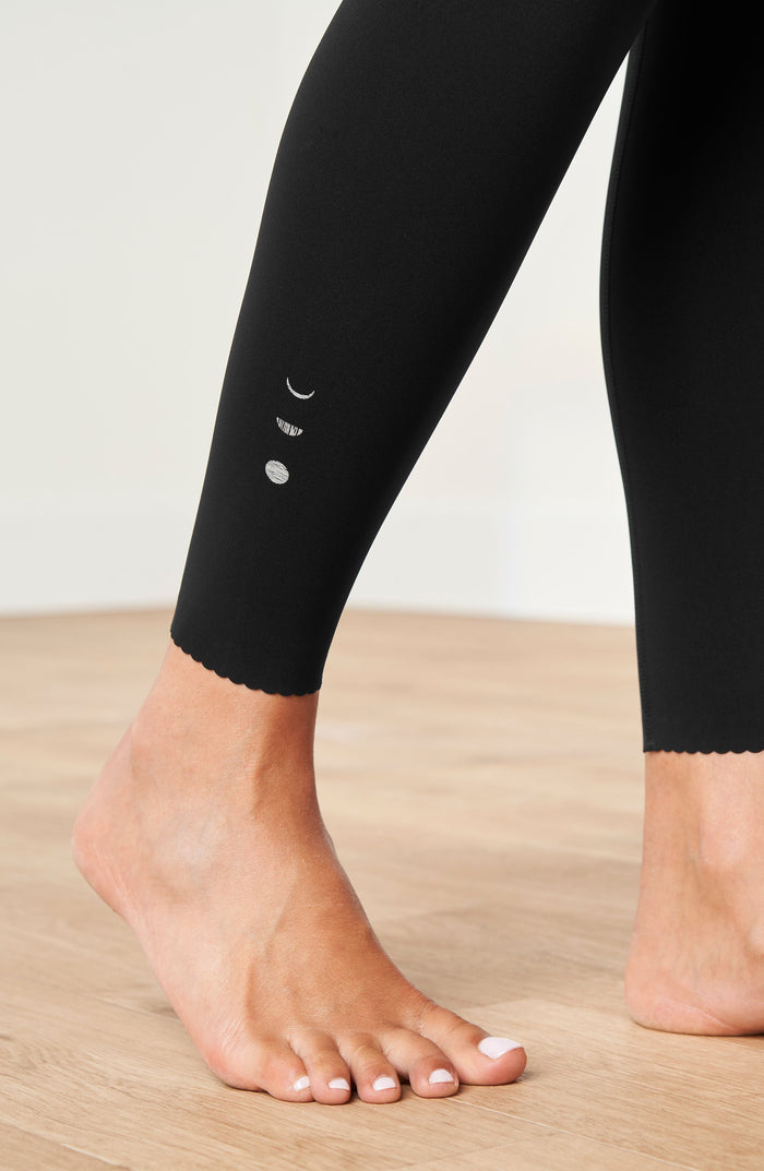 Close up ankle detail of the Elastique Athletics Adorn Leggings in black showing the fitted cuff and seamless finish.