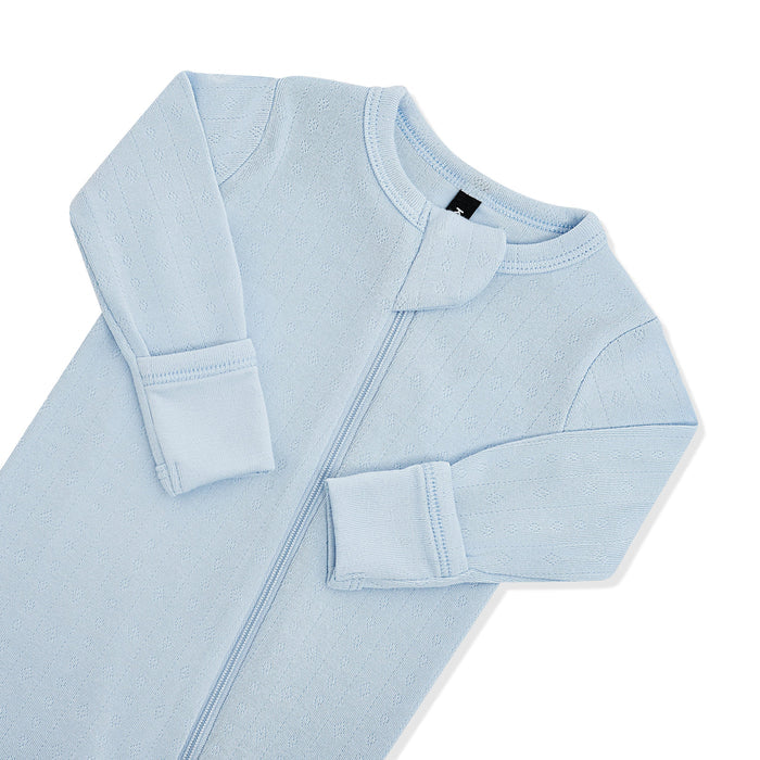 Close up of the zipper garage and fold over handcuffs on the Pointelle Zippered Footie in Breeze