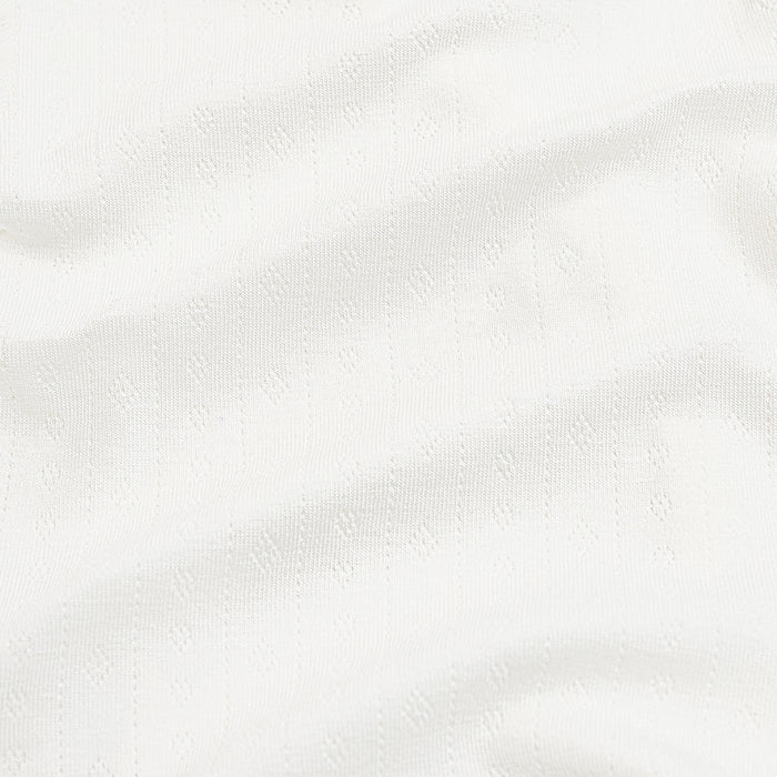 Close up of the white pointelle fabric