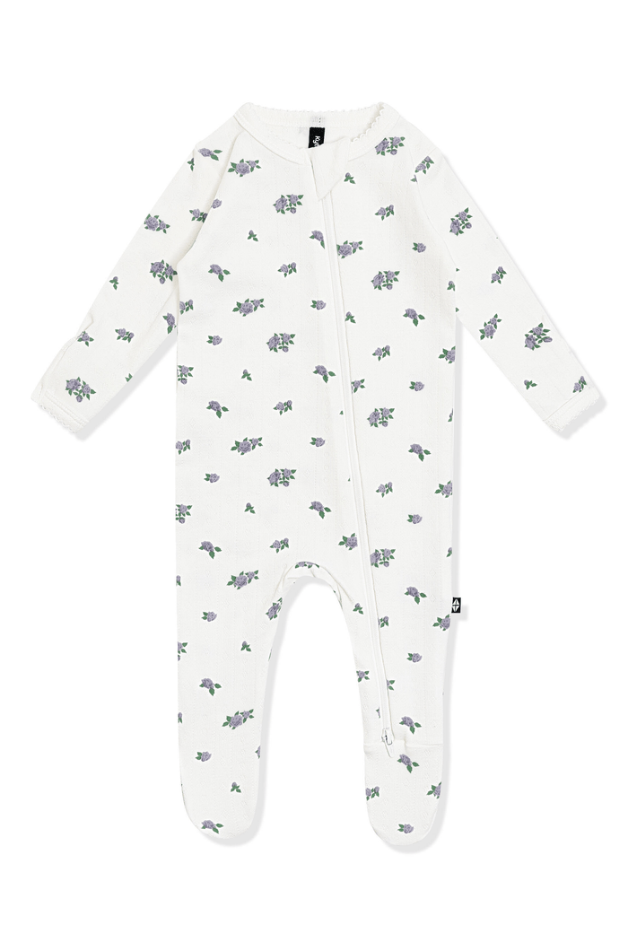Pointelle Zippered Footie in Spray Rose with the picot trim on a white surface