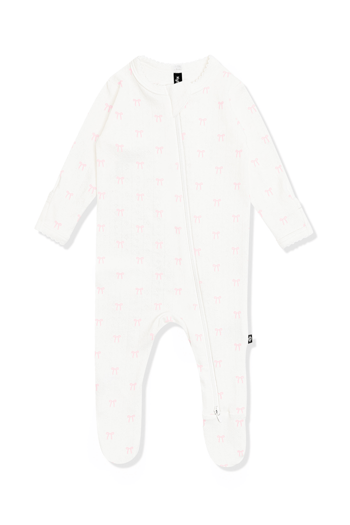 Pointelle Zippered Footie in Sweet Pink Bow with the picot trim on a white surface