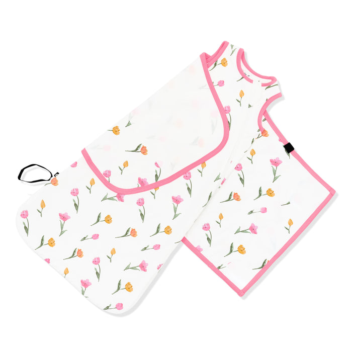 Adjustable velcro shown on an unswaddled Sleep Bag Swaddler in Tulip 0.5