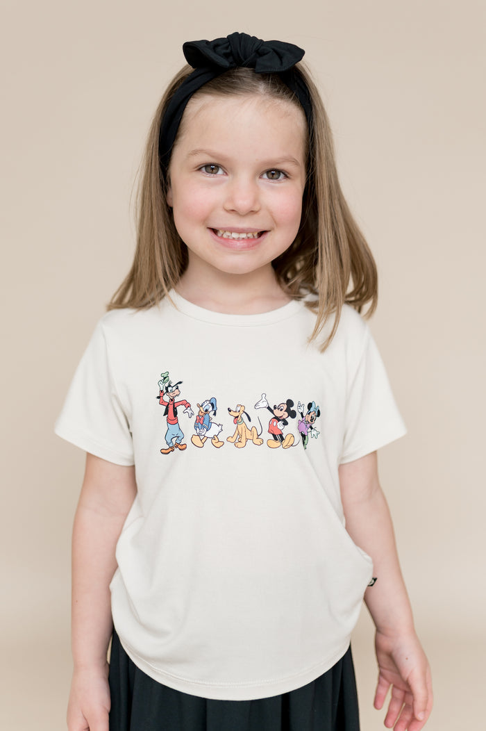 Girl wearing a mickey and friends graphic tee