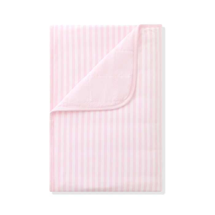 Product photo of the Toddler Blanket in Small Sakura Stripe 1.0 with the corner flipped down showing the light pink backing