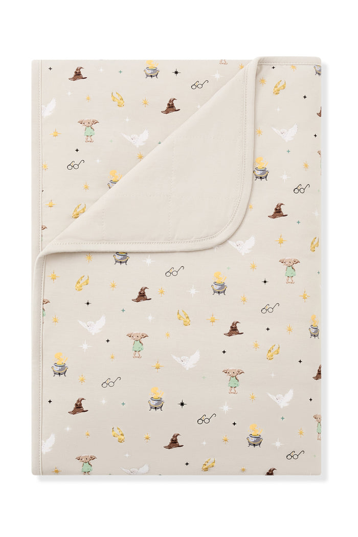 Beige Toddler blanket with Harry Potter print on a white background