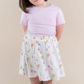 Close up of the Toddler Skort in Tulip shown with a basic tee in thistle on a young model