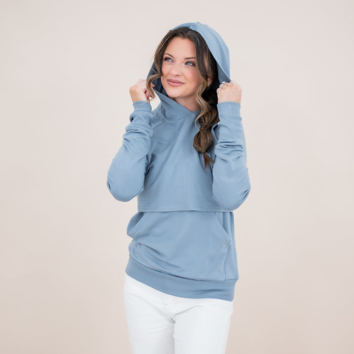 Female model wearing the Women's French Terry Nursing Hoodie in Slate with the hood up